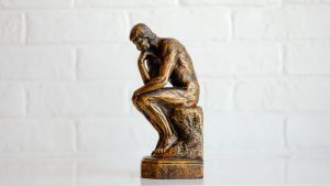 Statue of man pondering